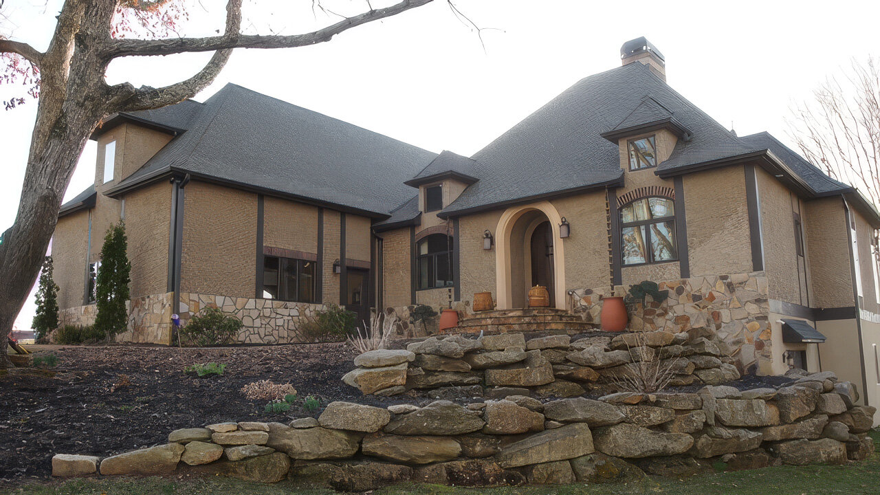 Pigmented lime-sand stucco exterior in natural light, troweled finish from the studio's project library