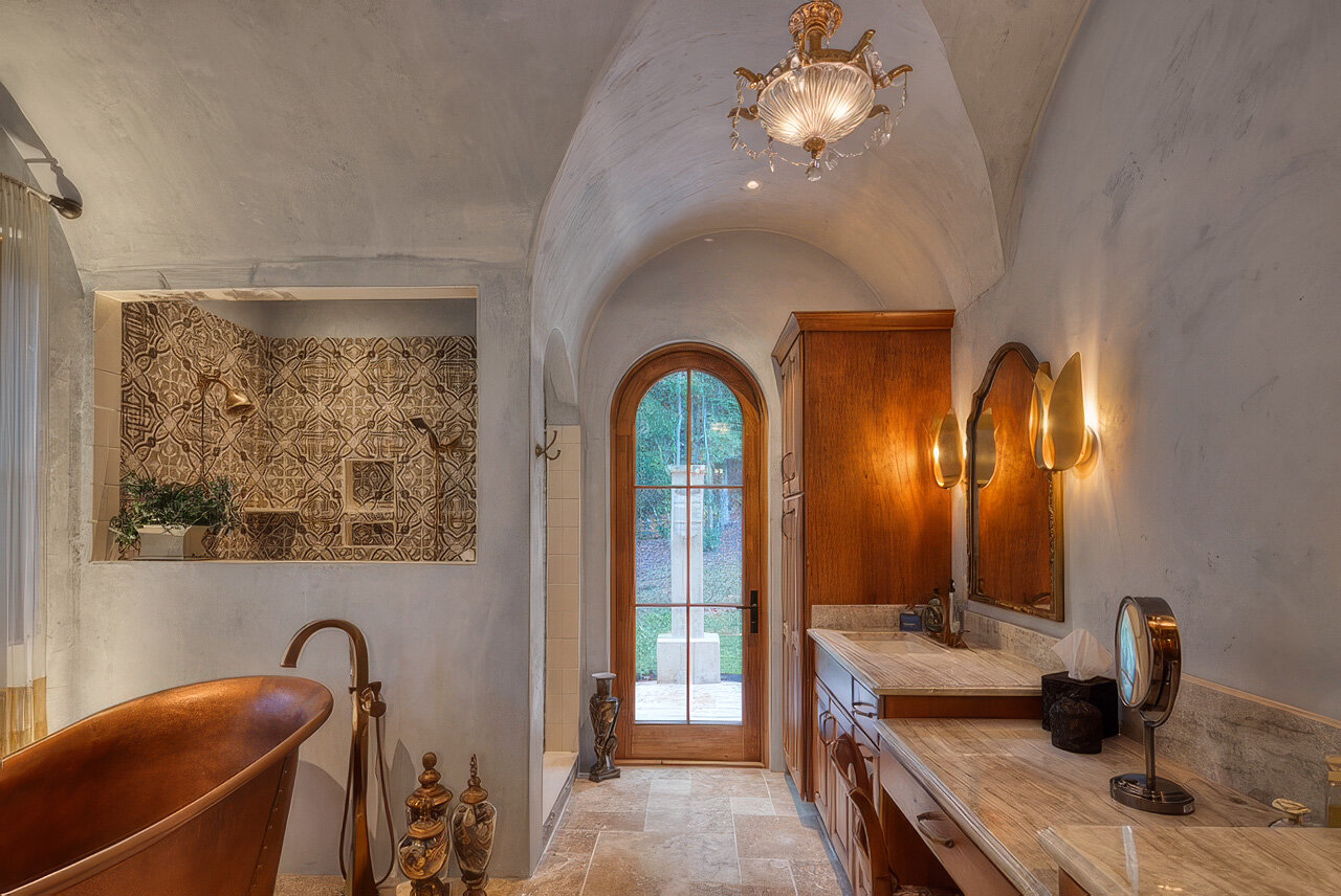 Single-coat limestone plaster wall in a residential interior, soft mineral pigment in natural light from the studio's project library