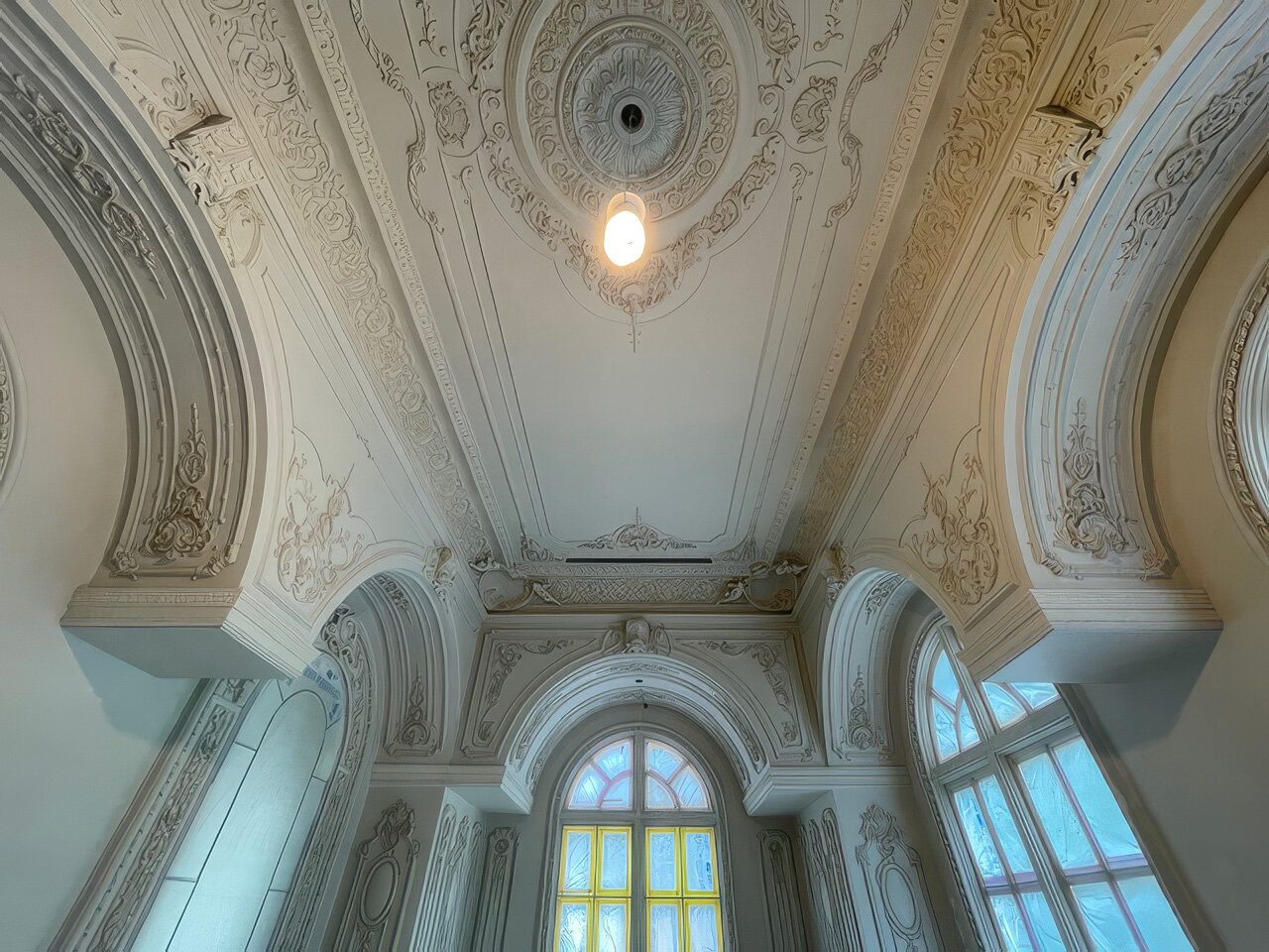 Plaster molding work over a veneer hardcoat substrate, profile detail in natural light from the studio's project library